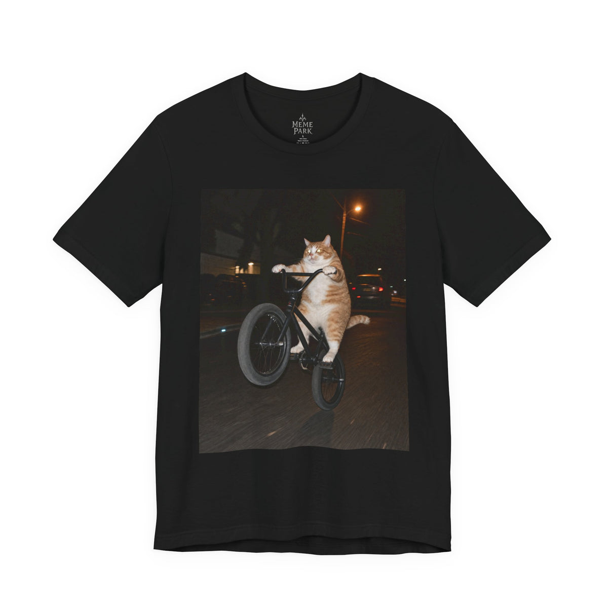 Black BMX Cat Tee, front view with an orange-and-white cat doing a bicycle wheelie at night.