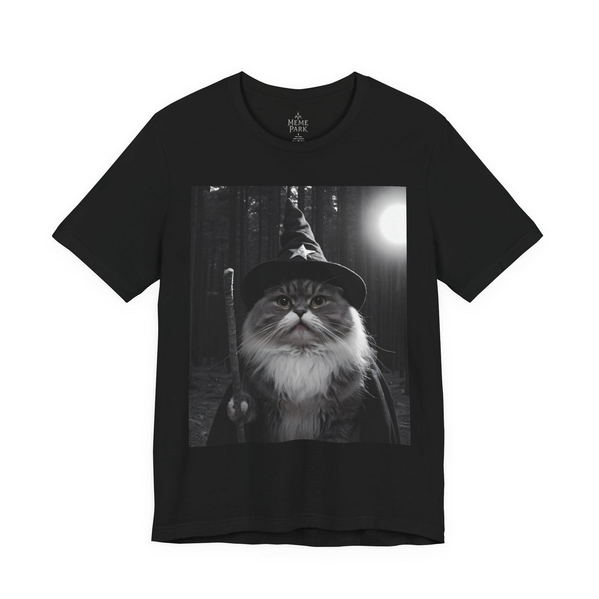 Black Wizard Cat Tee, front view with a grayscale fluffy cat in a wizard hat against a moonlit forest.