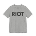Heather gray RIOT Tee, front view with bold black RIOT lettering across the chest.